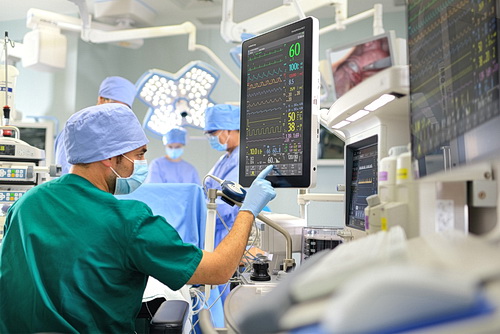 Doctor looking at screen in an emergency room